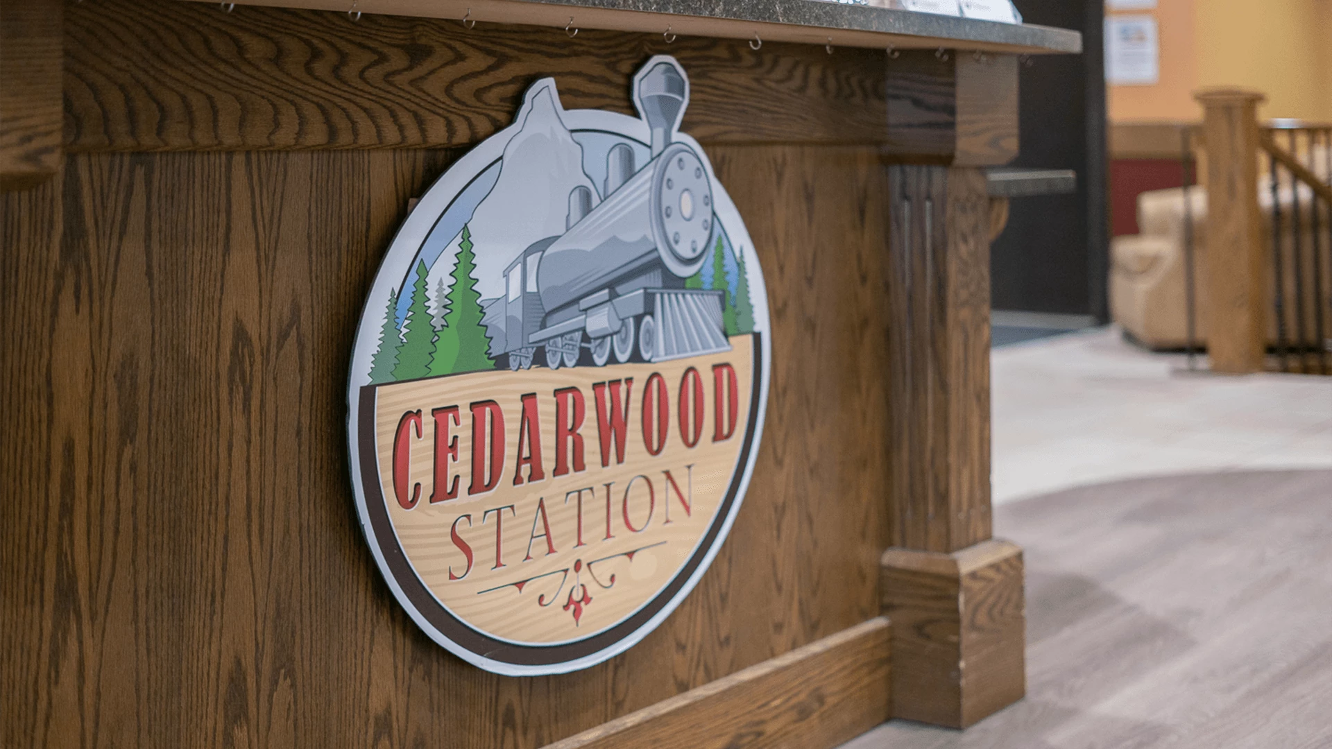 A logo of Cedarwood Station